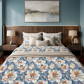Grand Peony Bedsheet Set with oversized ivory and cream peonies with golden centres on dusty steel blue background styled on a luxury bed