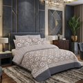 Ivory Ikat Medallion 7 Piece Comforter Set with geometric ogee lattice and sunflower medallions in grey and taupe on warm cream background styled on a luxury bed