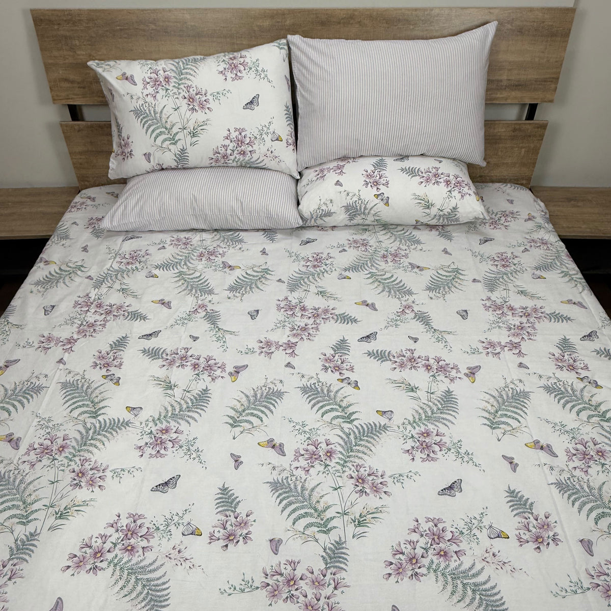 Meadow Mist Bedsheet Set with soft pink florals, green fern fronds and butterflies on crisp white background