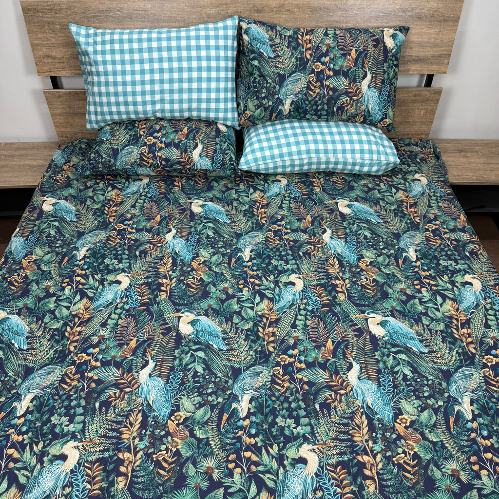 Heron Jungle Bedsheet Set with majestic blue herons and tropical foliage on deep navy background