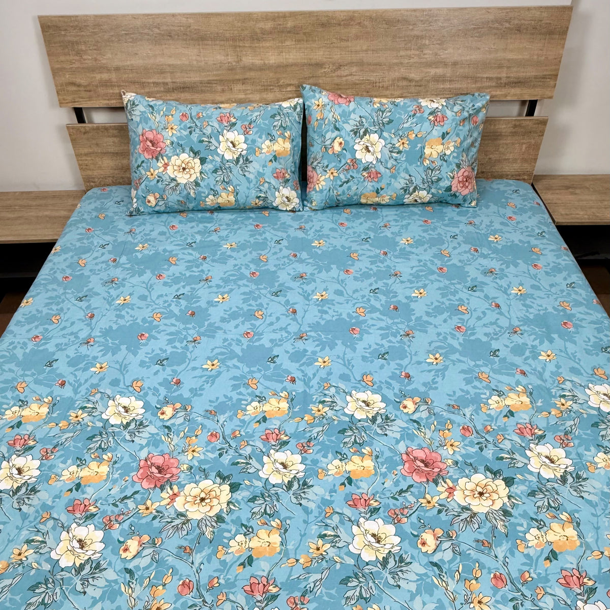 Teal Peony Bedsheet Set with blooming peonies and roses in white cream yellow and pink on soft teal blue background