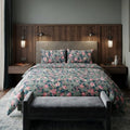 Sage Rose Bedsheet Set with scattered dusty pink and blush roses on muted sage slate green background styled on a luxury bed