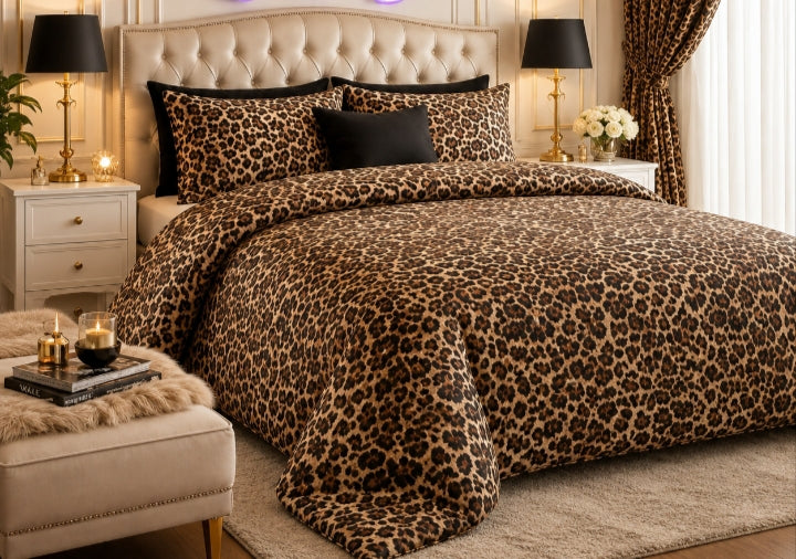 Golden Leopard Print 7 Piece Comforter Set with classic dark brown and black leopard rosette spots on rich golden-brown background with solid black pillow covers styled in a gold-black luxury bedroom