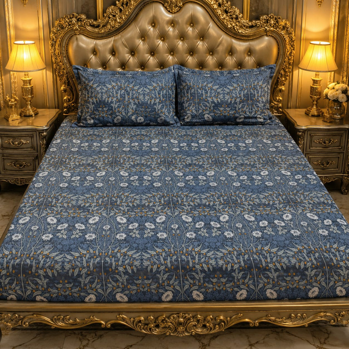 Navy Carnation Vine Bedsheet Set with dense William Morris-inspired trailing white carnation blooms and grey-green leaves on deep navy slate-blue background styled on a grand gold baroque luxury bed