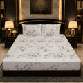 Grey Eucalyptus Bedsheet Set with large scattered watercolour grey-taupe eucalyptus branches and rounded leaves on crisp white background styled in a dark gold luxury bedroom