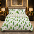 Green Fern Forest 7 Piece Comforter Set with scattered large watercolour fern fronds and pine trees on crisp white background with sage-green stripe flat sheet styled in a marble-gold luxury bedroom