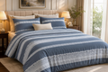 Azure Stripe Bedsheet Set styled on a luxury bed in an elegant bedroom